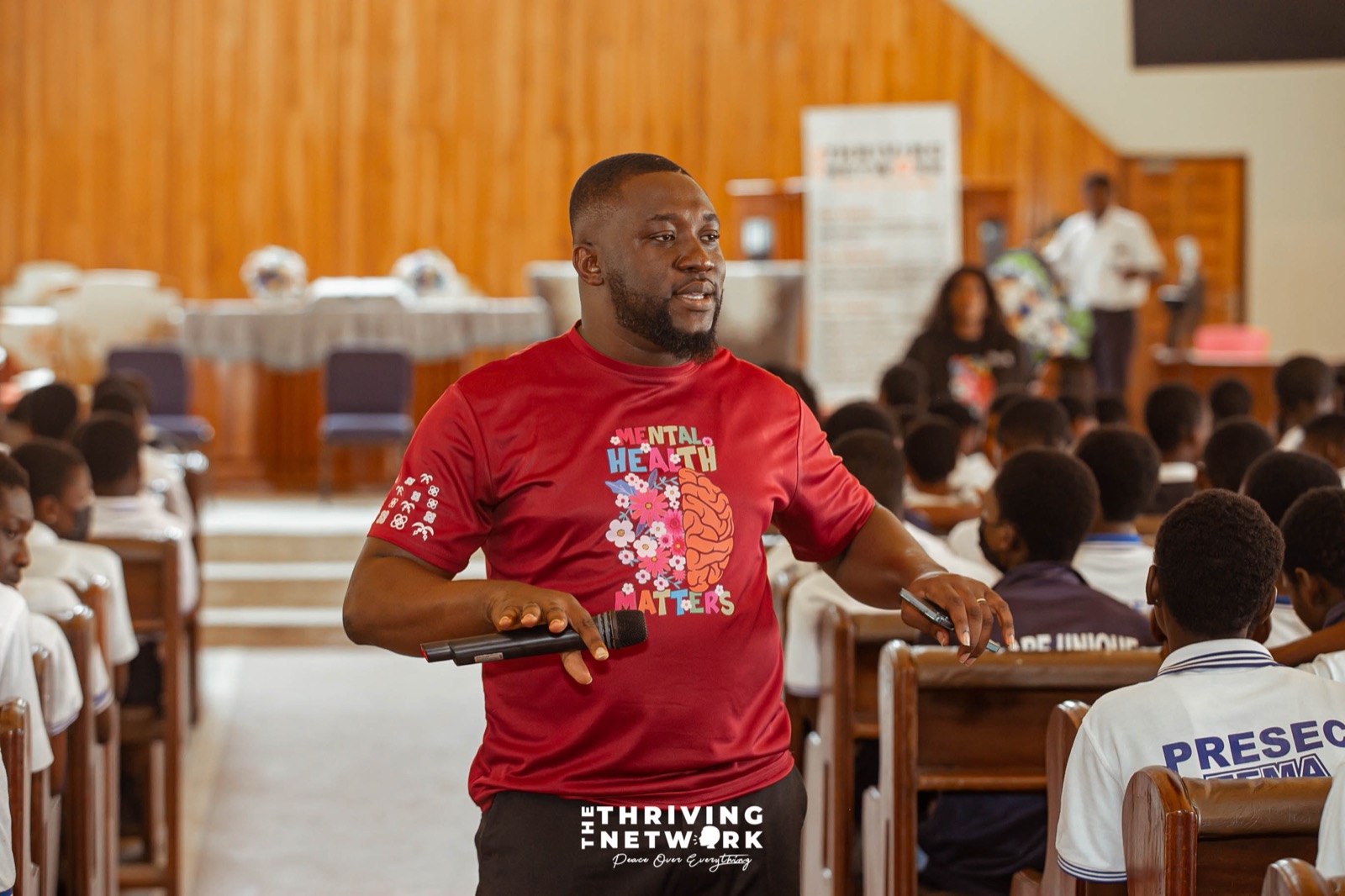 A speaker addressing students during a mental health education programme in Tema